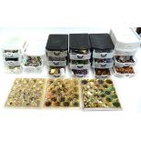 A very large collection of craft beads and buttons in 6 storage drawer units to include wooden