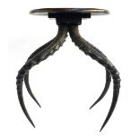 Taxidermy interest, an unusual occasional table, the legs formed from two sets of impala antlers,