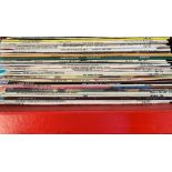 A mixed box of vinyl LPs, including some musicals; together with a black vinyl record holder, of