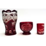 Three pieces of cranberry glass (af), a cut glass vase, 16cmH