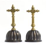 A pair of 19th century Aesthetic Movement brass and bronze doorstops, each 27cm high