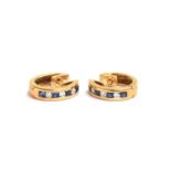 A pair of 18ct gold sapphire and diamond half hoop earrings, each set four square cut sapphires