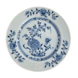 A Chinese Nanking cargo plate with blue and white peony design, bears label for Christies lot 3651