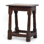 An oak joint stool, moulded top on block turned legs and square stretchers, 44cm wide, 29cm deep,