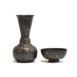 An Indo-Persian bronze and mixed metal bottle vase with inlaid silver Bidri work, 22cm high;