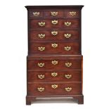 A George III mahogany chest on chest, the projecting moulded cornice above three over three drawers,