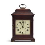 An oak cased mantel clock, moulded pediment, white enamel dial with Roman numerals and outer