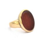 A gold signet ring, the inset carnelian with intaglio engraved monogram ECB, 9.7g