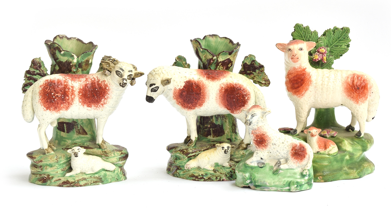 A pair of Staffordshire pearlware spill vases in the form of a ewe and ram, each with lamb, 13cmH; - Image 2 of 2
