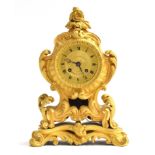 A 19th century French Ormolu mantel clock, the gilt dial with Roman Numerals signed 'Huguenin A