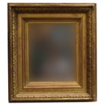 A 19th century giltwood picture frame with beveled mirrored plate, internal dimensions 50 x 40cm