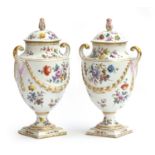 A pair of Dresden Helena Wolfsohn urns and covers, each with baluster body and scrolled handles,