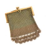 A finely worked 9ct gold mesh purse with two ball clasp, two tone effect with intricate design at