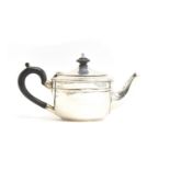 A George V bachelor's teapot by Charles Edwards, London 1919; together with a small cream jug by