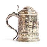 A George I silver lidded tankard, by David Willaume I, London 1724, later chased, bearing the