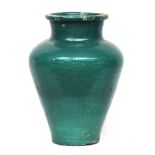 A large early 20th century green glazed olive jar (af), 66cm high