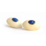 A pair of bone cabochon clip earrings set with 9ct gold and lapis lazuli, each 2.5cmD