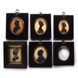 A collection of five 19th century miniature silhouette portraits in ebonised frames, each approx.