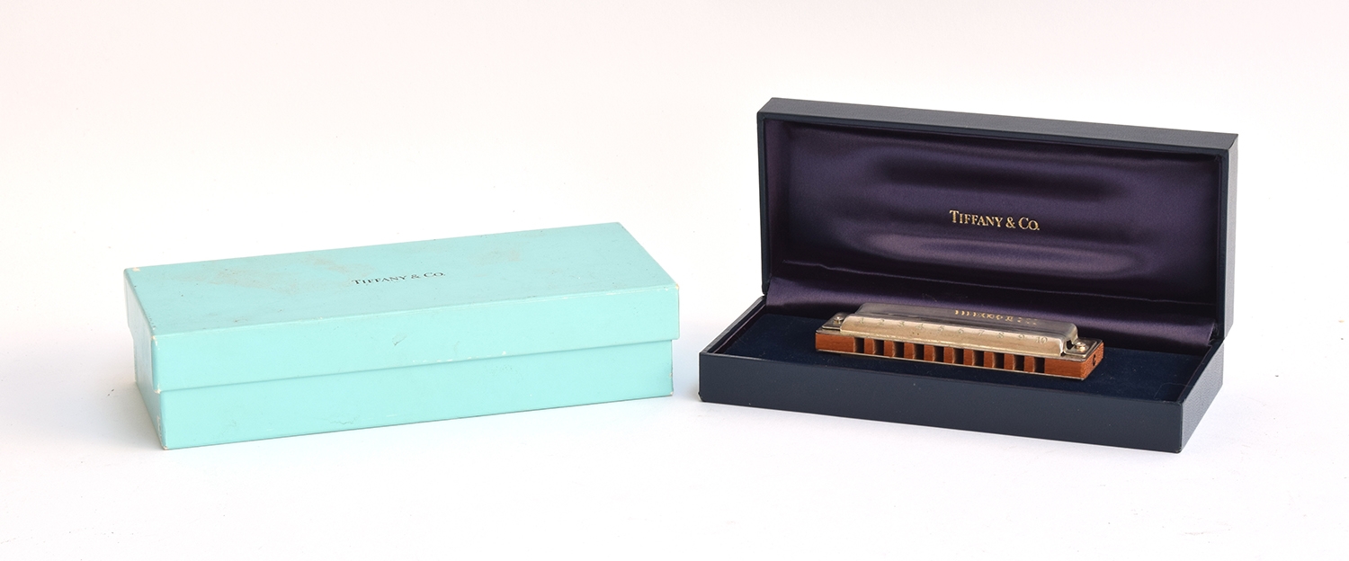 A Tiffany & Co. 925 silver harmonica made by Hohner, in case and box; together with a Tiffany &
