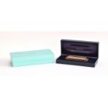 A Tiffany & Co. 925 silver harmonica made by Hohner, in case and box; together with a Tiffany &