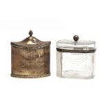 A silver tea caddy by Haseler Brothers, London 1912, pointed oval form with gadrooned borders, 8.