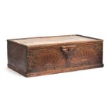 A 17th century oak bible box, demilune and lozenge carving, later lined, 69cm wide, 40cm deep,