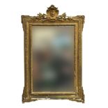 A giltwood wall mirror, the rectangular plate with laurel and bell flower cresting, 63cm wide,