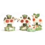 A pair of Staffordshire pearlware spill vases in the form of a ewe and ram, each with lamb, 13cmH;