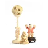 A 19th century Chinese puzzle ball, 5cm diameter and stand 12cm high; together with a stained