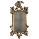 A 19th century gilt gesso mirror, the plate within pierced scrolls and foliate, with ho-ho bird