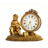 A French gilt metal figural mantel clock in the form of a drummer boy with dog, enamel dial with