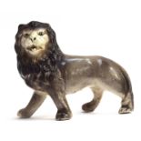 A 19th century Staffordshire figure of a standing lion, 15cmH
