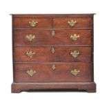 A George II oak chest of drawers, the moulded two plank top over two short and three long drawers