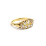 An 18ct gold boat shaped ring set with eight diamonds, in openwork setting, size M, approx. 4.4g