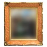 A burr maple and parcel gilt picture frame, with bevelled glass plate