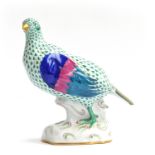 A Herend porcelain partridge, green fishnet pattern, marked to base, 23cm high