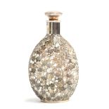 A whiskey dimple bottle, with all over .950 silver prunus lattice, 22cm high
