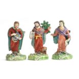 Three Staffordshire Pearlware figures of saints (af), St. Luke, 18.5cm high, St. Mark, 18.5cm