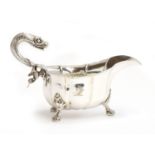 A George III silver sauce boat of generous proportions, maker's mark rubbed, London 1762, with