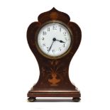 An Edwardian mahogany and marquetry balloon cased mantel clock, Arabic numerals to white enamel