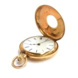 A Victorian 18ct gold half hunter pocket watch, the white enamel dial with Roman numerals and