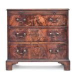 A George III mahogany bachelor's chest, the moulded top over brushing slide and three cockbeaded