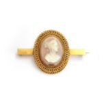 A Victorian gold agate cameo brooch, carved oval portrait of a lady within wirework border, 6.6g (
