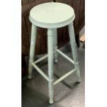 A painted wooden kitchen stool
