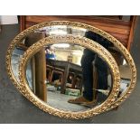 Two oval gilt framed mirrors, 73cmL and 56cmL