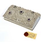 A vintage Indian Zari clutch purse, with profuse silver thread brocade decoration, set with cut