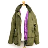 A ladies WoodGreen tweed shooting coat, size 16, with purple quilted lining, little worn