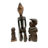 Three carved African tribal figures, the tallest 62cmH