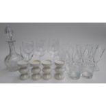 A quantity of glasses to include tumblers and wine glasses; together with four tea light holders and
