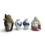 Two Chinese figurines, a Buddha, 8.5cmH and Immortal, 10cmH; together with two miniature blue and